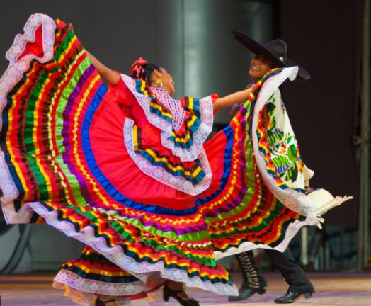 “A burst of color as folklórico dancers sweep across the floor, the swirling skirt capturing the spirit of Cinco de Mayo.”
