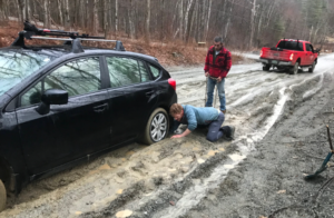 Car stuck in mud during spring mud season