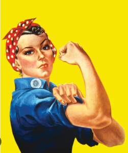 A vintage “We Can Do It!” poster featuring a woman in a blue work shirt with a rolled-up sleeve, flexing her arm and wearing a red polka‑dot bandana against a bright yellow background.