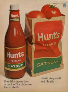 A vintage Hunt’s Tomato Catsup advertisement showing a bottle of catsup beside a paper bag filled with tomatoes, highlighting how many tomatoes are used to make each bottle.