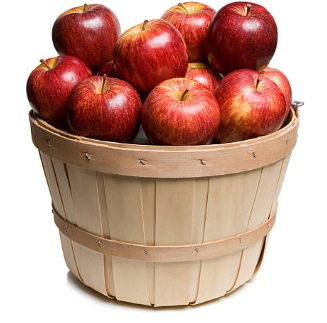 A rustic wooden basket brimming with deep red apples, glowing like a perfect fall harvest.